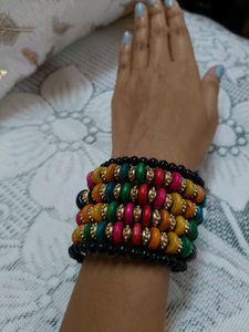 This is a colorful boho-style beaded bracelet stac