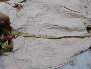 Beige Romper with Ruffle Detail