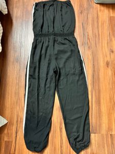 This sleek and stylish off-shoulder tube jumpsuit