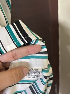 A Multi-coloured striped top.