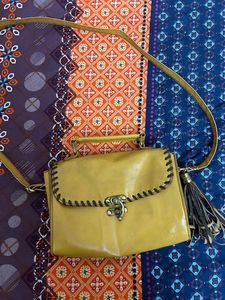 at half rate now mustard hand bag
