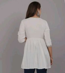 White Embroidered Peplum Top