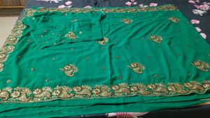 Elegant rama colour Embroidered Saree