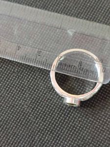 Pure silver ring with green zircon stone.