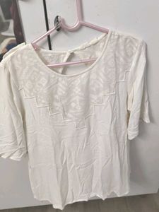 Elegant White Top With Geometric Detailing