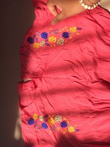 pink stretchy top with flowers embodery