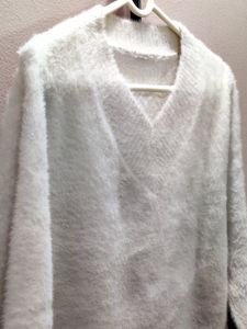 premium imported white V-neck mohair sweater.
