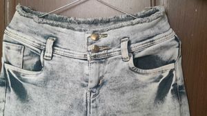 light grey, acid-wash or faded jeans.