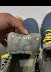 Blue and gray high top shoes
