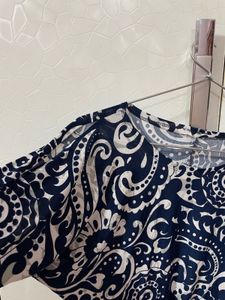 Blue Top shoulder cuts