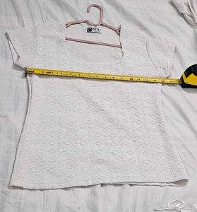 White, short-sleeve top with a textured pattern