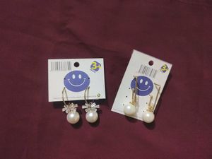 2 pair of gold plated pearl earrings with a stone