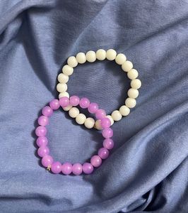 white and lilac needed bracelets
