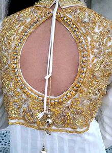Stunning white gown with gold accents ✨