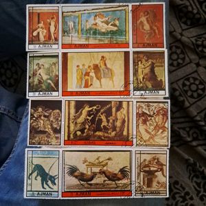 12 Vintage AJMAN painting stamps
