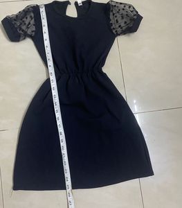 Chic Black Dress with Polka Dot Sleeves