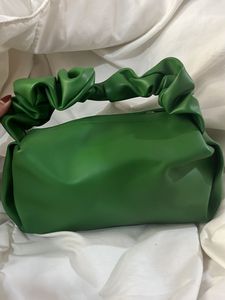 green scrunched hand bag