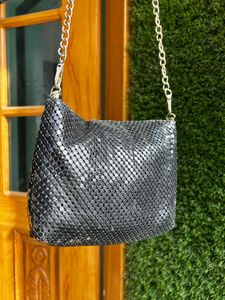 Black metal mesh sling bag