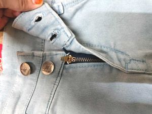 Light Blue Jeans With Criss Cross Design