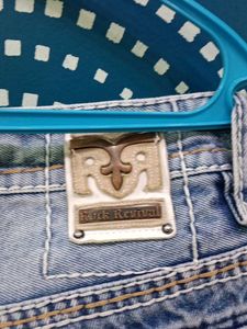 Ripped Light Wash Denim Jeans