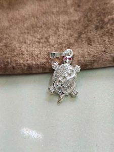Turtle design locket with pink stone