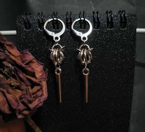 Spiked round chained earrings
