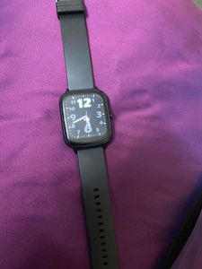 Sleek Black Smartwatch With Charger