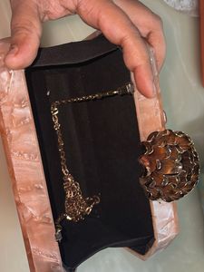 Emblished Onaxe marble Clutch