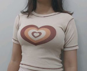 beige crop top with brown heart