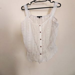 button-up tank top with spaghetti straps.