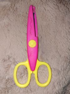 A scissor for cutting Designed Border of paper