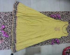 Yellow Sleeveless Dress with Embellished Hem