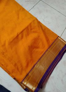Mustard color saree with purple border and blouse