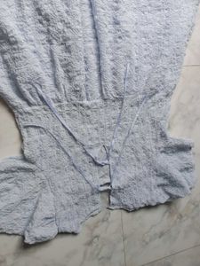 Light Blue Textured Dress With Bow Detailing