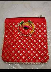Red,rani pink, and purple Embroidered Clutches