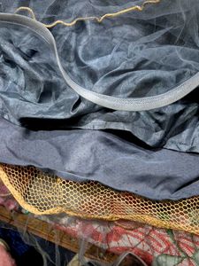 black paplum blouse and grey skirt