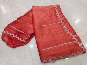 Elegant Red Saree with Silver Embellishments
