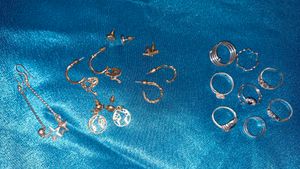 Assorted Gold Tone Earrings and Silver Rings