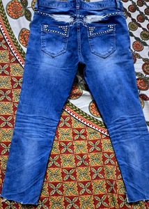 Girls ripped embroided jeans like new.