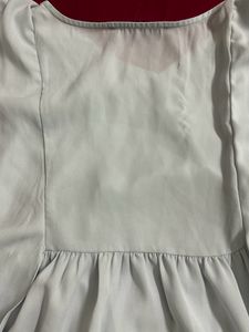 light blue frilled top