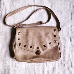 Cream Sling bag.