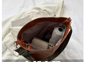 Grey Handbag with Colorful Strap