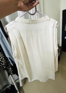 Sleeveless Button-Up Blouse
