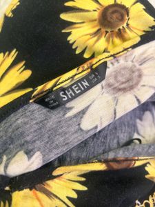 halter neck crop top featuring a vibrant sunflower