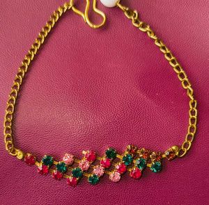 Gold Chained Bracelet With Rare Stones.