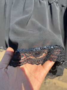 Black Ruffle Skirt With Some Design Down
