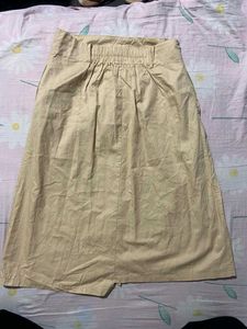 It Is a Cute Brown Skirt With Buttons