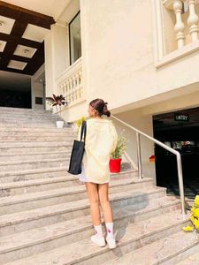 trendy yellow shirt