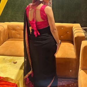 Selling Black Georgette Saree With Rani Pink Blous