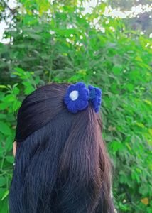 “Handmade wool crochet clutch with floral elegance